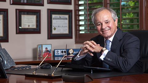 aurelio fernandez sitting at desk