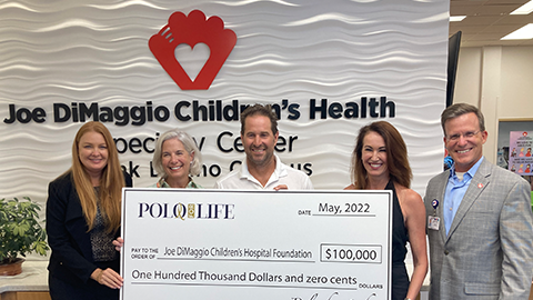 polo for life check donation presentation