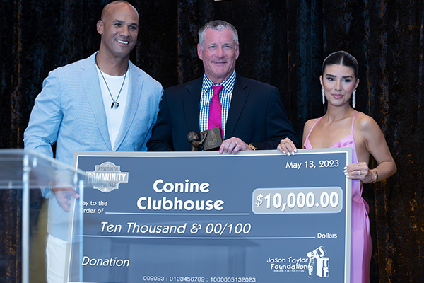 Jeff Conine receiving donation for Conine Clubhouse from Jason and Monica Taylor