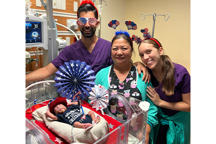 NICU team and baby July 4