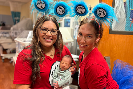 Nurses holding newborn at MRH NICU Read-a-thon 2024