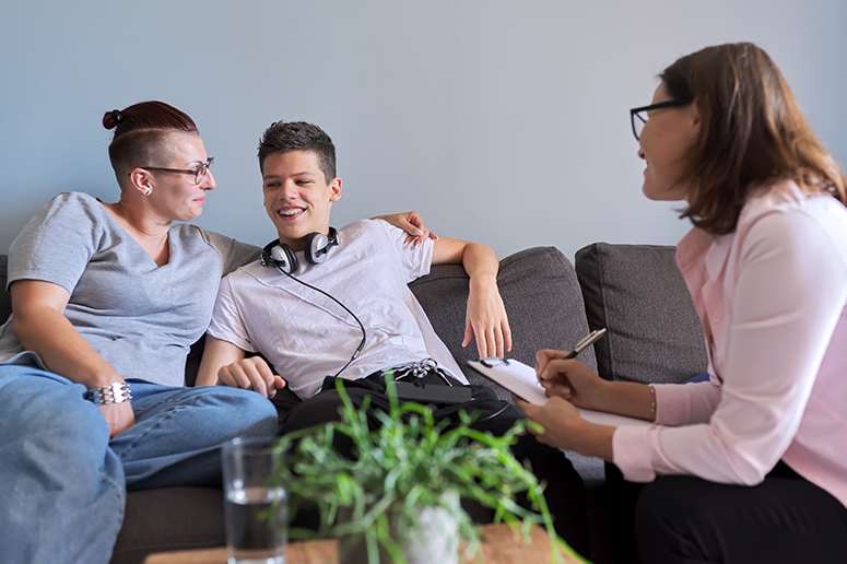 mother and son meeting with therapist