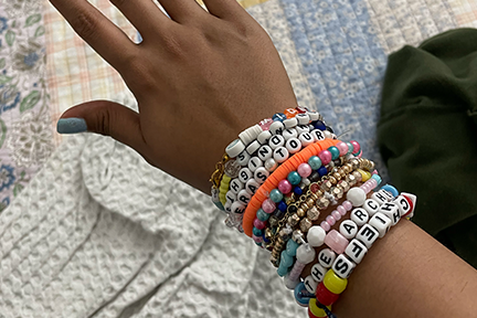 Valentina displaying her custom-made stacking bracelets for Taylor Swift's Eras Tour in Miami