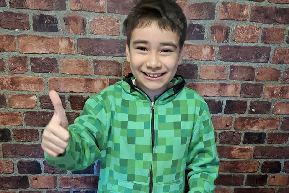 Bastian smiling at camera.