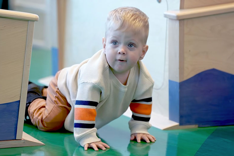 Baby Casey crawling around the room.
