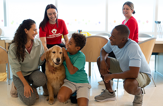 Child life specialist with child on Child life zone