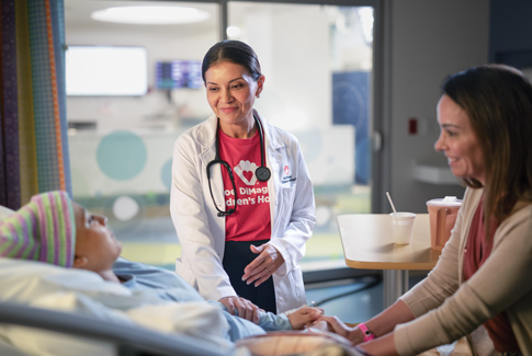 Oncology patient and mom with Doctor Carmen Ballestas