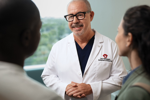 Orthopedic doctor with family of patient