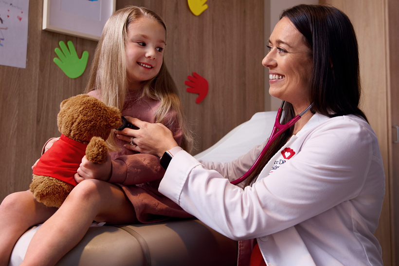 Female doctor with pediatric cardiac patient