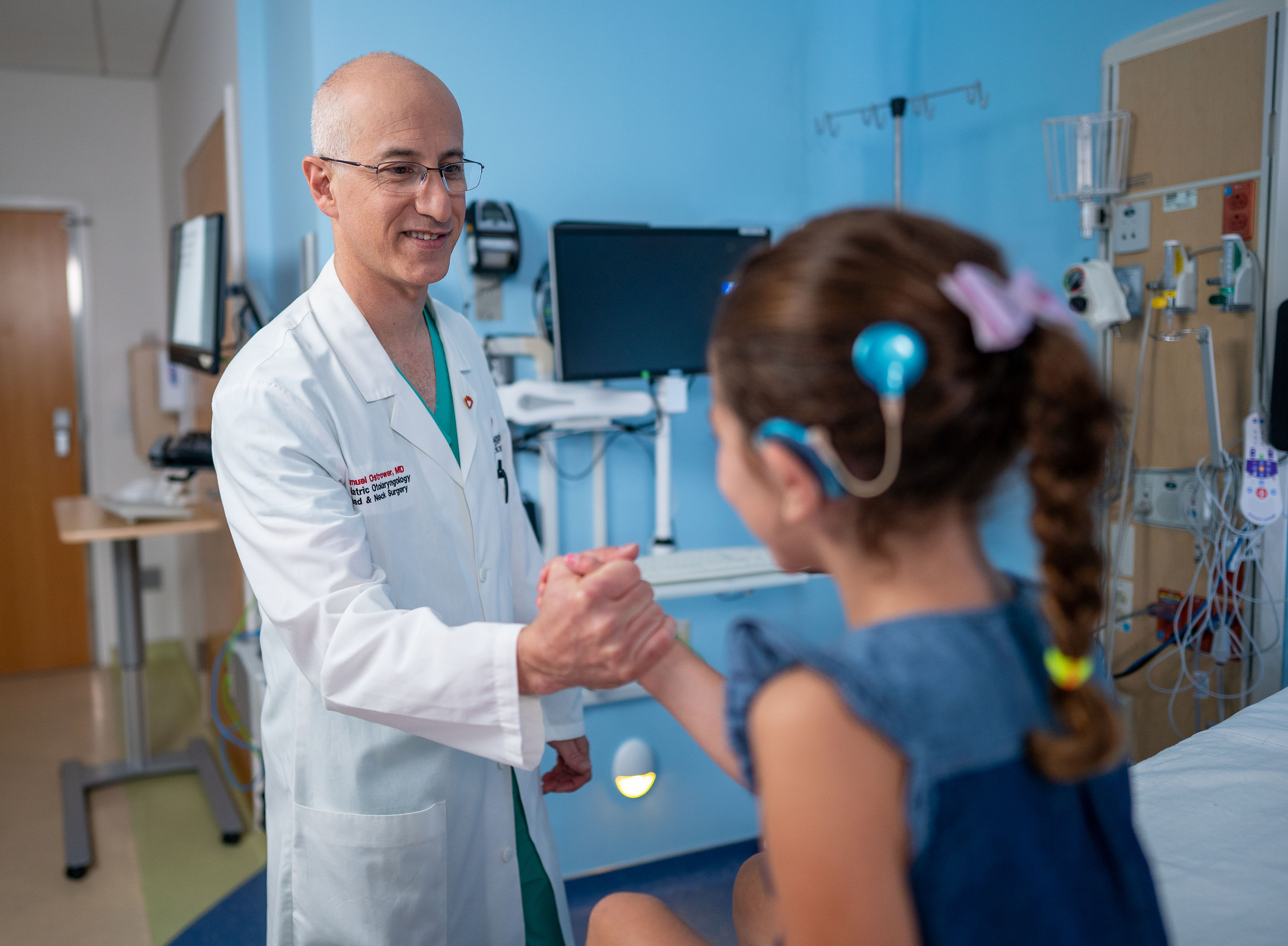 Dr. Ostrower with patient who has a cochlear implant