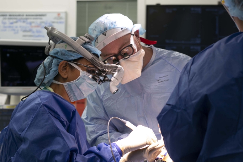 Pediatric Neurosurgeons inside the Operating Room, Performing surgery