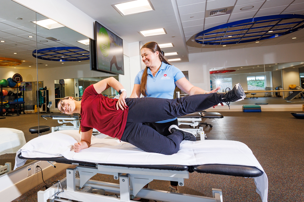 Pediatric patient doing rehabilitation exercises with therapist
