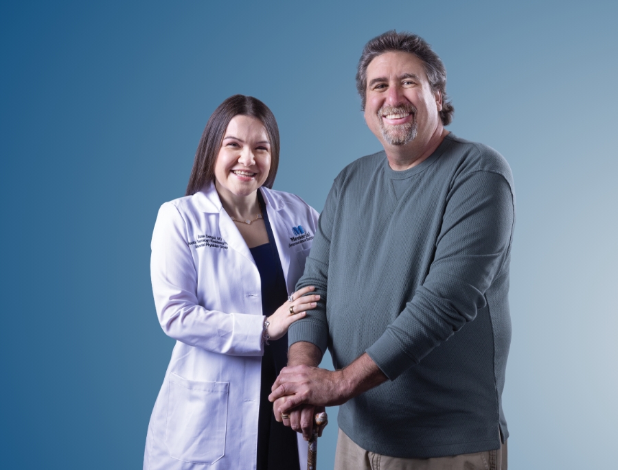 Doctor standing next to a neurology patient