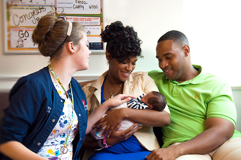 Employee with baby and family