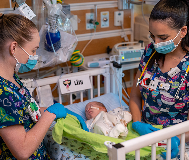 Wasie Neonatal Intensive Care (NICU) nurses caring for Lily, who was born prematurely